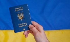 How can I obtain a residence permit in Ukraine through employment in a Ukrainian company or public organisation?